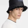 Der Bacino-Bucket-Hat Hut aus ausgefranstem Raffia