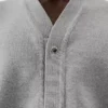 Die geknöpfte Strickjacke Geknöpfte Strickjacke