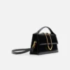 Die große Bambino Crossbody-Tasche mit Metallklappe