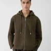 Die Piqué-Strickjacke mit Kapuze Piqué-Strickjacke mit Kapuze