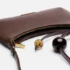 Die Schultertasche Bisou Perle mit Perlenverzierung